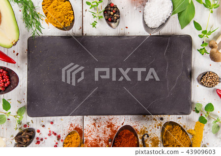 Various colorful spices on wooden table Various colorful spices on wooden table 43909603