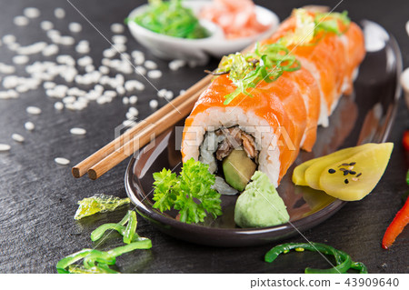 Japanese sushi set on a rustic dark background. 43909640
