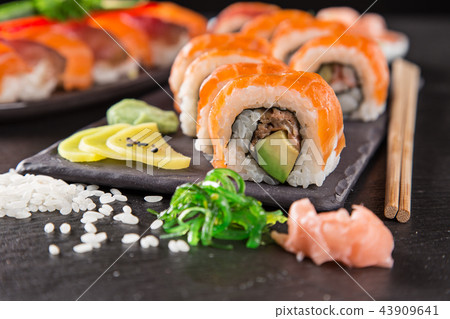 Japanese sushi set on a rustic dark background. 43909641