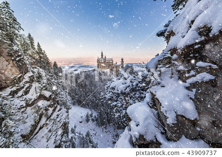 Neuschwanstein Castle during sunrise in winter landscape. Neuschwanstein Castle during sunrise in winter landscape. 43909737