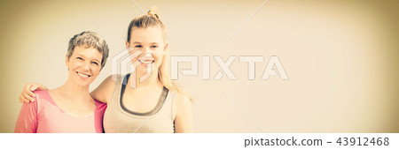 Sporty mother and daughter smiling Sporty mother and daughter smiling 43912468