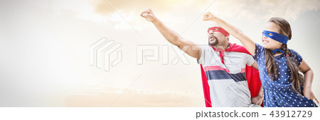 Composite image of father and daughter pretending to be superhero 43912729