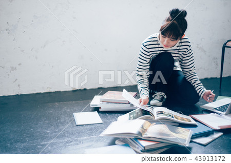 Female typing computer 43913172