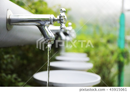 water tap with water flow out from tap water tap with water flow out from tap 43915061