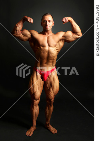 Male Bodybuilder Posing Showing Front Body Muscle Stock Photo 43915993 Pixta