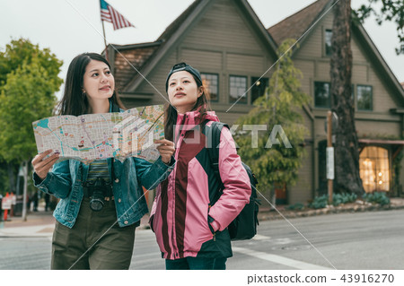 friends checking guidemap while visiting 43916270