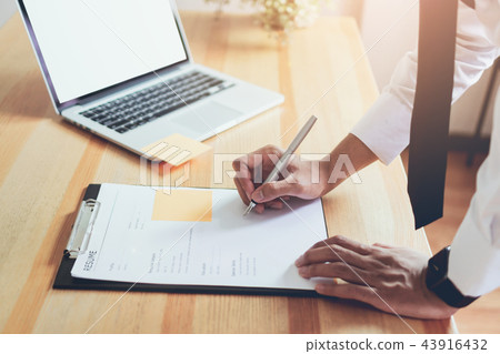 man writing form submit resume employer to review man writing form submit resume employer to review 43916432