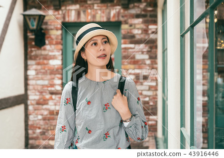 woman visiting ovely and retro building 43916446