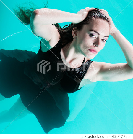 Sexual posing woman in water. 43917763