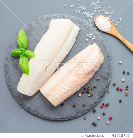 Fresh raw cod fillet with spices, pepper, salt Fresh raw cod fillet with spices, pepper, salt 43918703