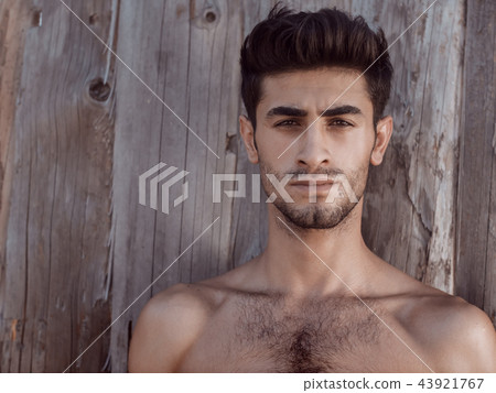Handsome topless young man outdoors Handsome topless young man outdoors 43921767