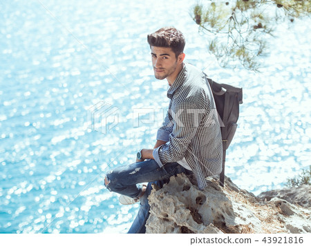 Man traveler near the sea 43921816