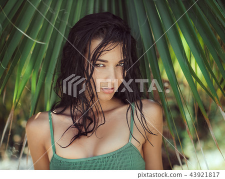 Beautiful girl posing in tropical forest. Close-up perfect portrait 43921817