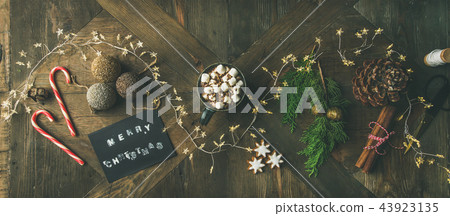 Flat-lay of greeting card, glittering toys, mug of hot chocolate, Flat-lay of greeting card, glittering toys, mug of hot chocolate, 43923135
