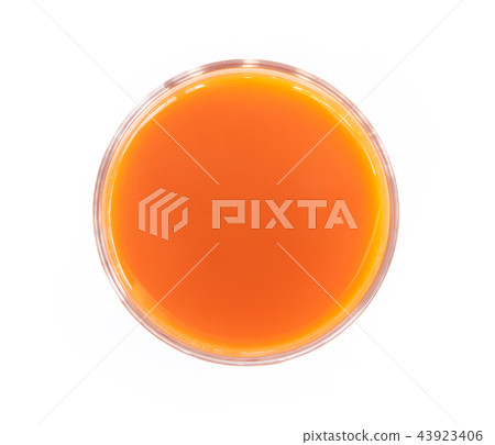 Closeup top view glass of fresh carrot juice Closeup top view glass of fresh carrot juice 43923406