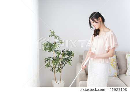 Woman doing housework Woman doing housework 43925108