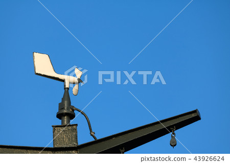Old wind turbine on the roof of ship with blue sky 43926624