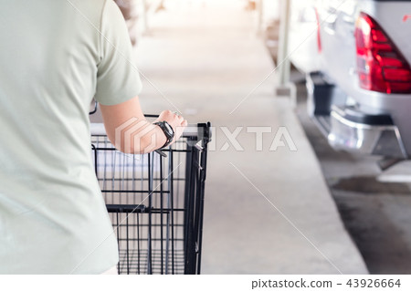 blurry of hand woman soft focus cart 43926664