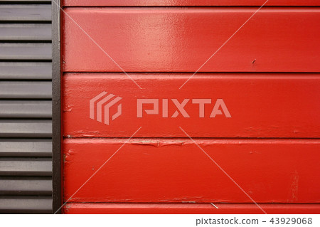 Red painted board wall and shutter 43929068