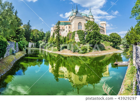 Bojnice castle is mirrored in water, Slovakia 43929297