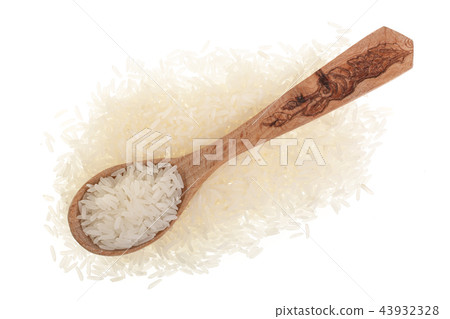 rice grains in wooden spoon isolated on white background. Top view. Flat lay rice grains in wooden spoon isolated on white background. Top view. Flat lay 43932328