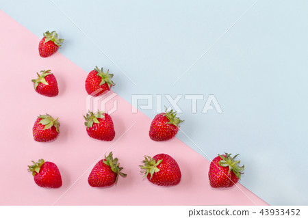 Bright ripe strawberry on a pastel background. Bright ripe strawberry on a pastel background. 43933452
