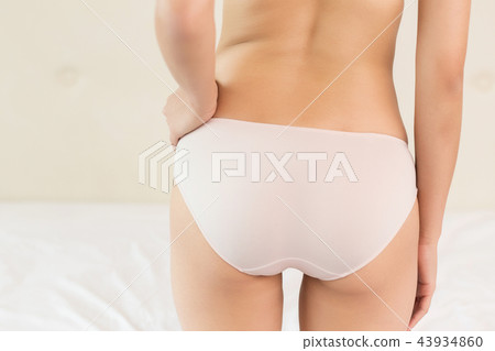 Girl buttocks on white background 43934860