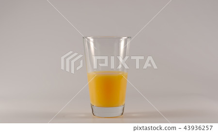 Glass with half of orange juice 43936257
