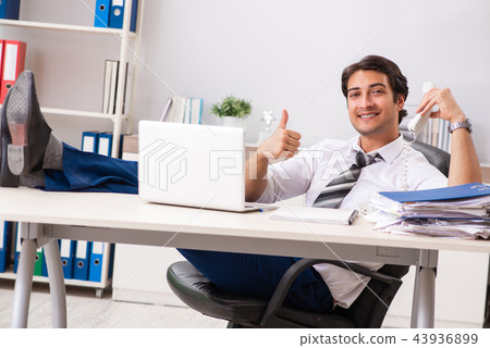 Young call center operator speaking on phone Young call center operator speaking on phone 43936899