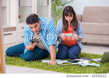 Young family in budget planning concept Young family in budget planning concept 43936912