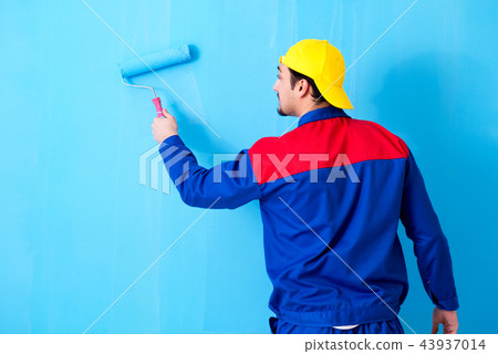 Young painter doing renovation at home Young painter doing renovation at home 43937014