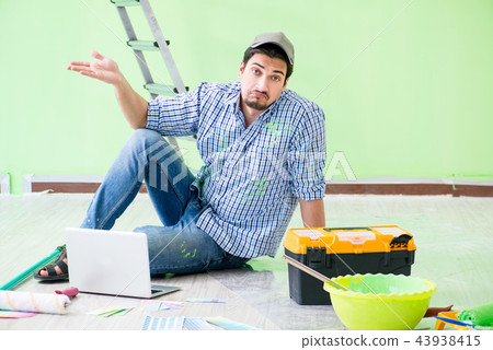 Young man doing home renovation Young man doing home renovation 43938415