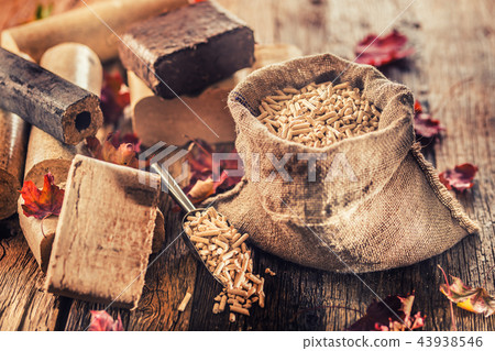 Wooden pressed pellets and briquettes from biomass Wooden pressed pellets and briquettes from biomass 43938546