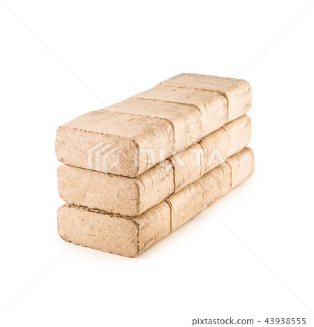 Wooden pressed briquettes from biomass on a white 43938555
