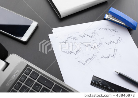 White desk office with laptop, smartphone and other work supplies 43940978