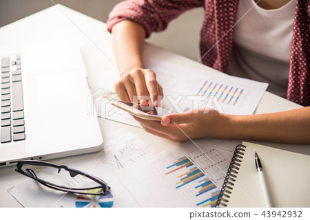 Businessmen use smartphones and laptop Businessmen use smartphones and laptop 43942932