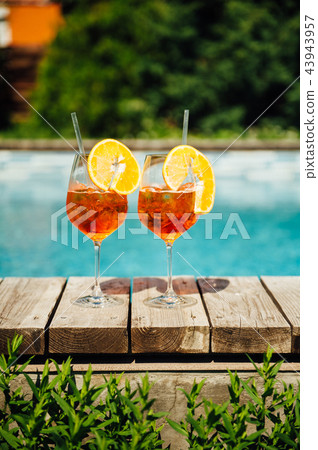 Two Glass of Aperol Spritz cocktail on the pool 43943957