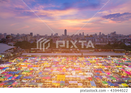 Aerial view multiple colour flea market roof top 43944022