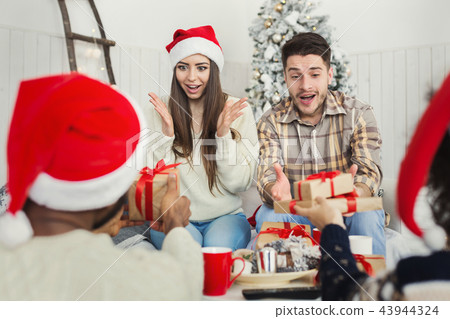 Presenting gifts as Christmas eve tradition 43944324