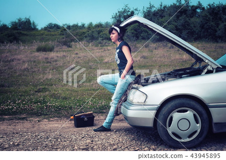 Fashion woman having troubles with the car Fashion woman having troubles with the car 43945895
