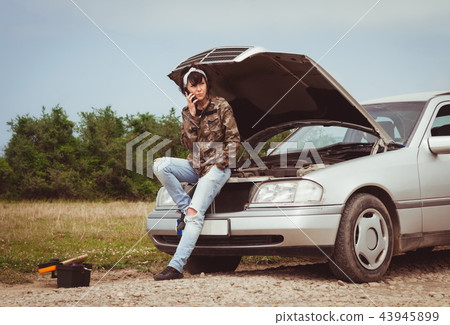 Fashion woman having troubles with the car Fashion woman having troubles with the car 43945899