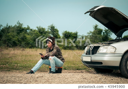 Fashion woman having troubles with the car Fashion woman having troubles with the car 43945900