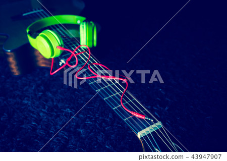headphone on acoustic guitar 43947907