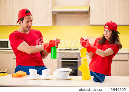 Cleaning professional contractors working at kitchen Cleaning professional contractors working at kitchen 43949505