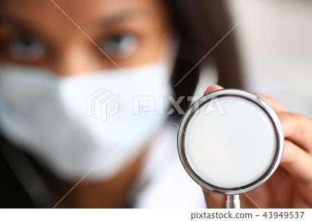 Black female doctor in a face mask Black female doctor in a face mask 43949537