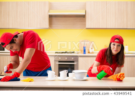 Cleaning professional contractors working at kitchen Cleaning professional contractors working at kitchen 43949541