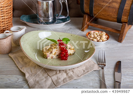 Close up view of beautiful elegant sweet dessert, pistachio roulette, served on the plate. Beautiful 43949987