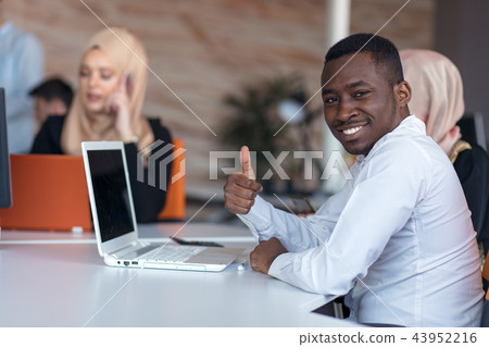 Startup business people group working everyday job at modern office. Tech office, tech company, tech Startup business people group working everyday job at modern office. Tech office, tech company, tech 43952216