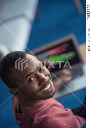 Close-up Of Person Typing On Laptop At startup office. Close-up Of Person Typing On Laptop At startup office. 43952303