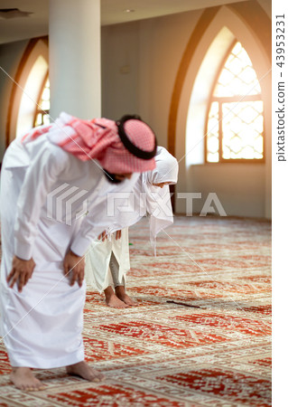 Muslim Praying man and woman in mosque Muslim Praying man and woman in mosque 43953231